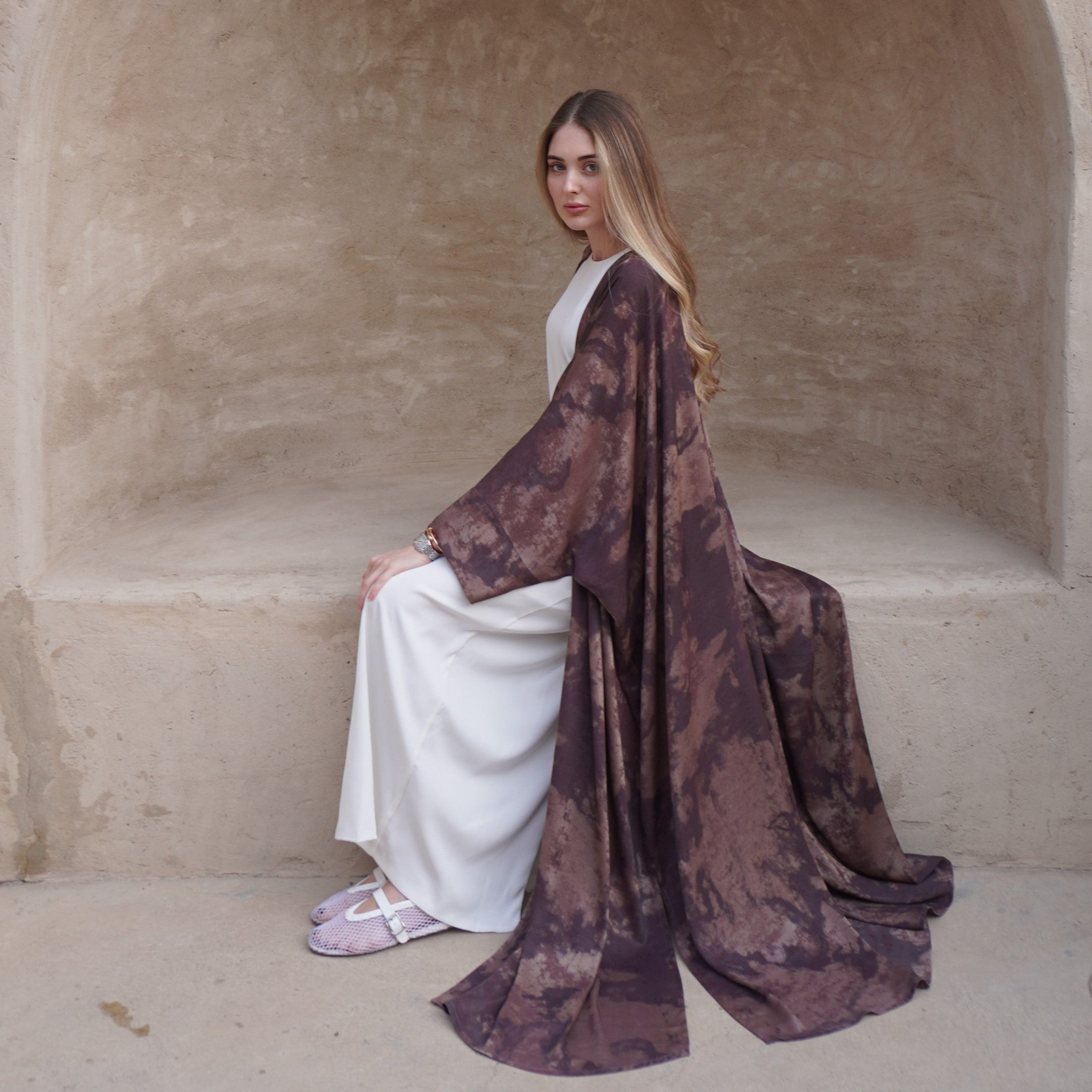 Matte Hawa silky polyamide butterfly open abaya, seated styling view
