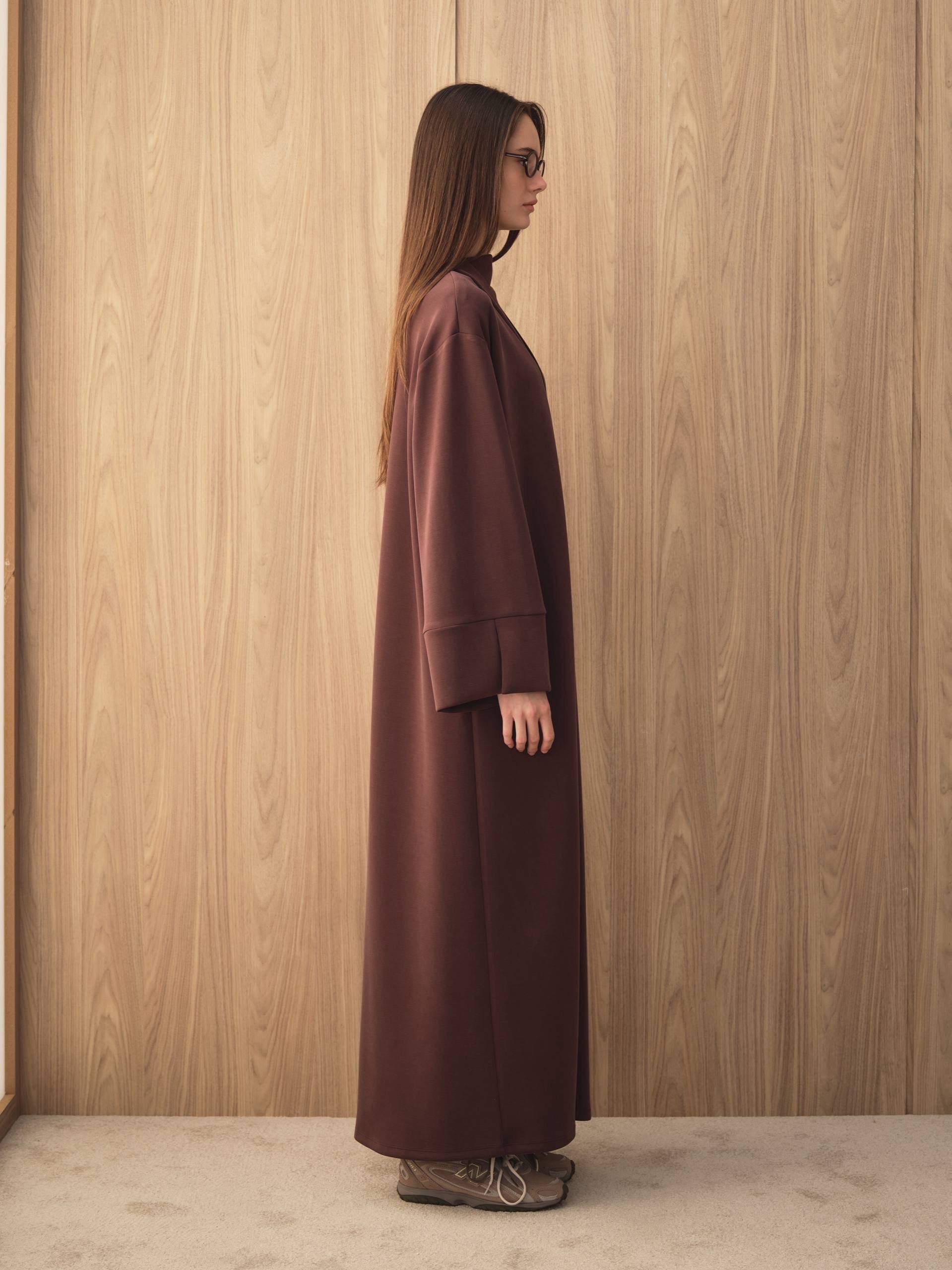 MOVE 01 Modal Stretch Abaya Set in Mahogany Burgundy, side view showing the fluid oversized silhouette.