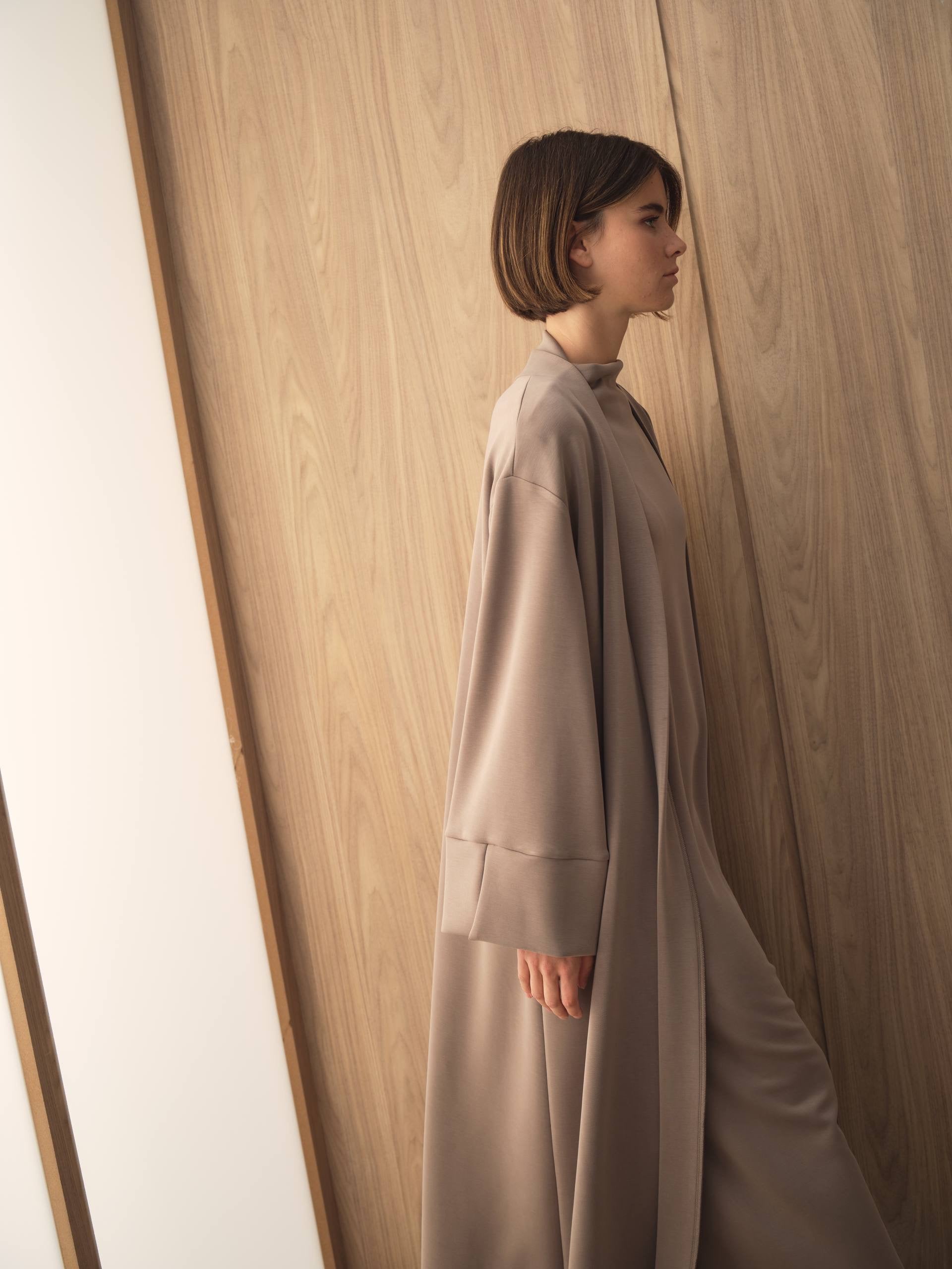 MOVE 01 Modal Stretch Abaya Set in Mushroom Taupe, movement view showing the fluid drape.