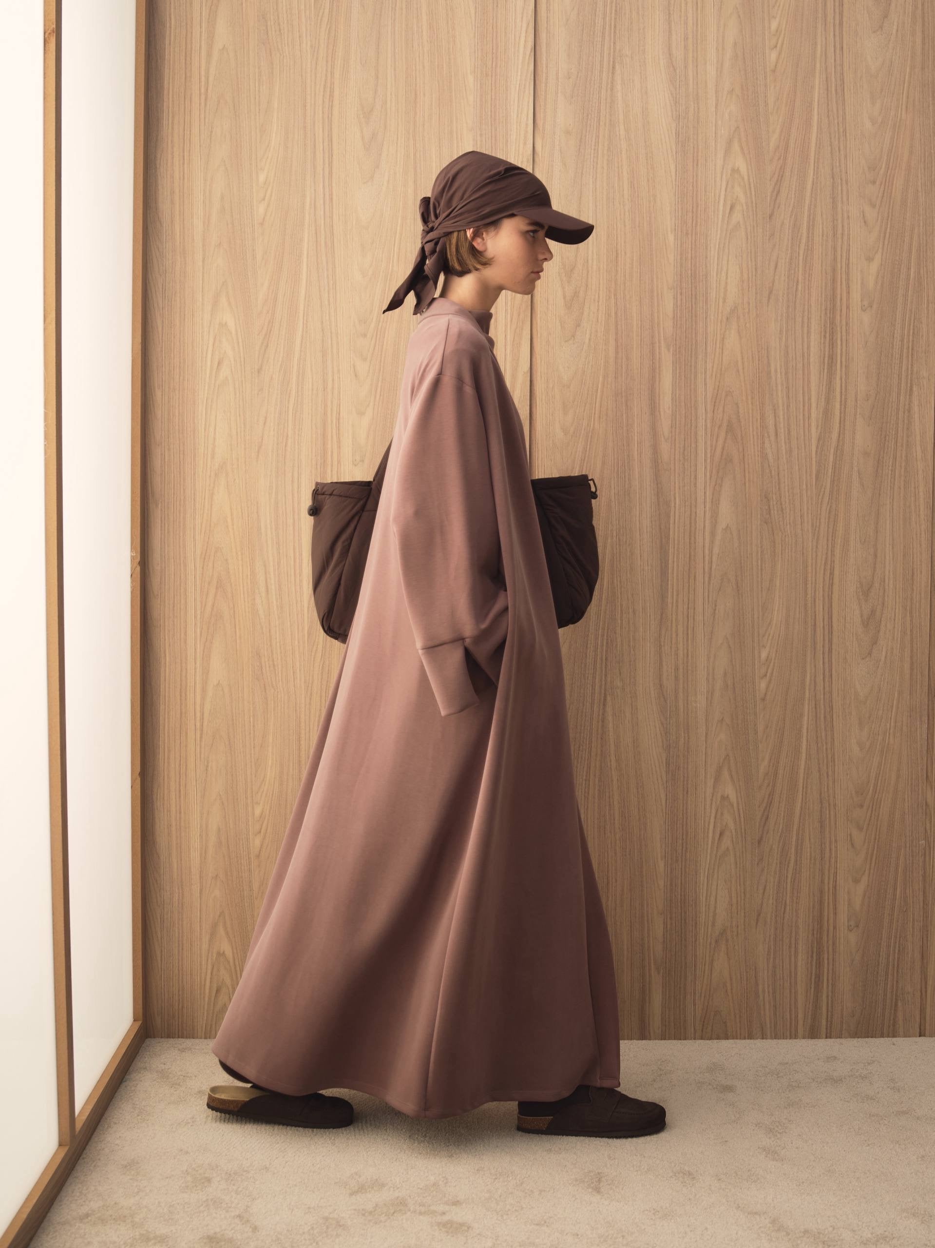 MOVE 01 Modal Stretch Abaya Set in Smoked Plum, movement view showing the fluid silhouette.