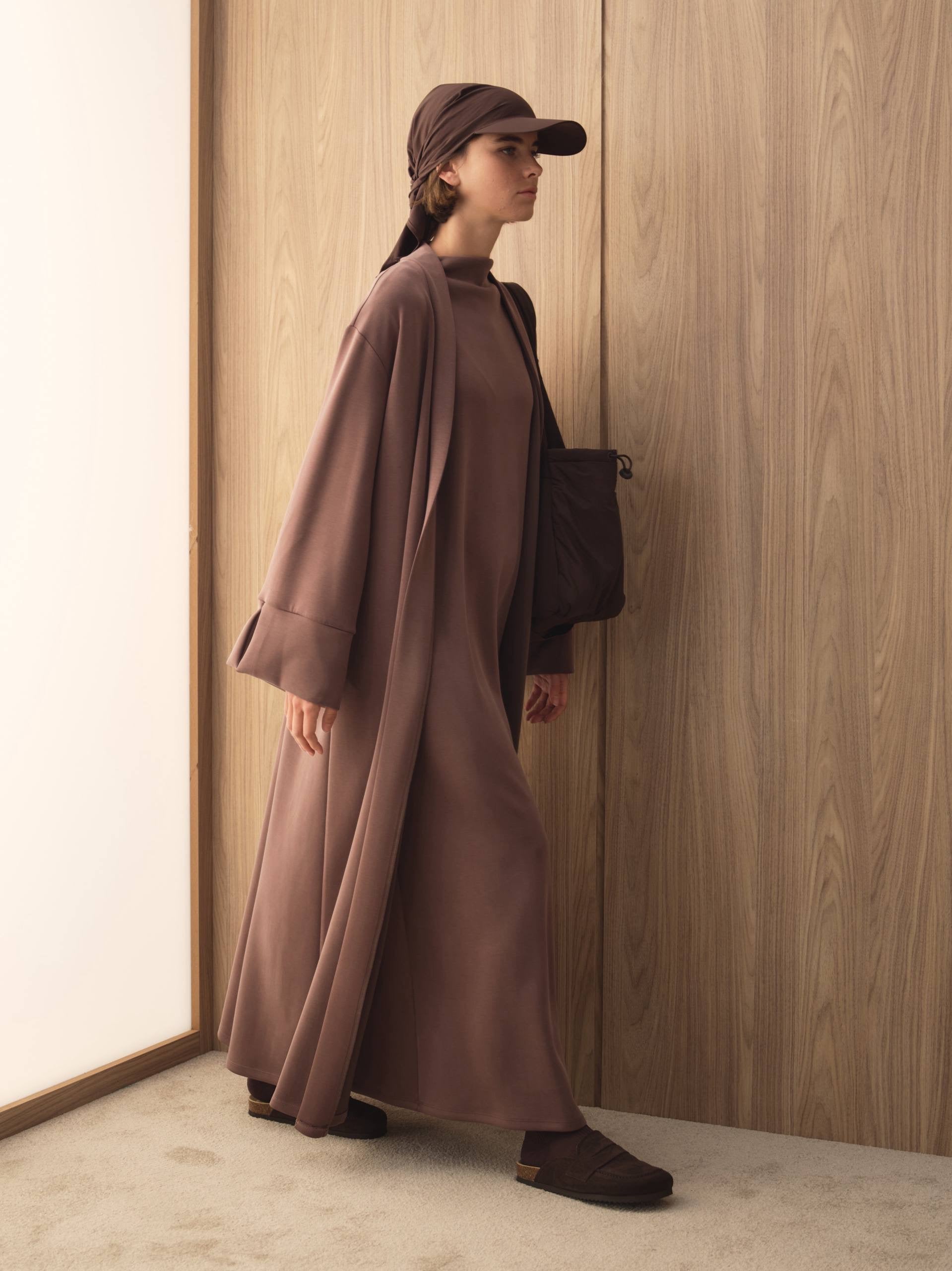 MOVE 01 Modal Stretch Abaya Set in Smoked Plum, side movement view.