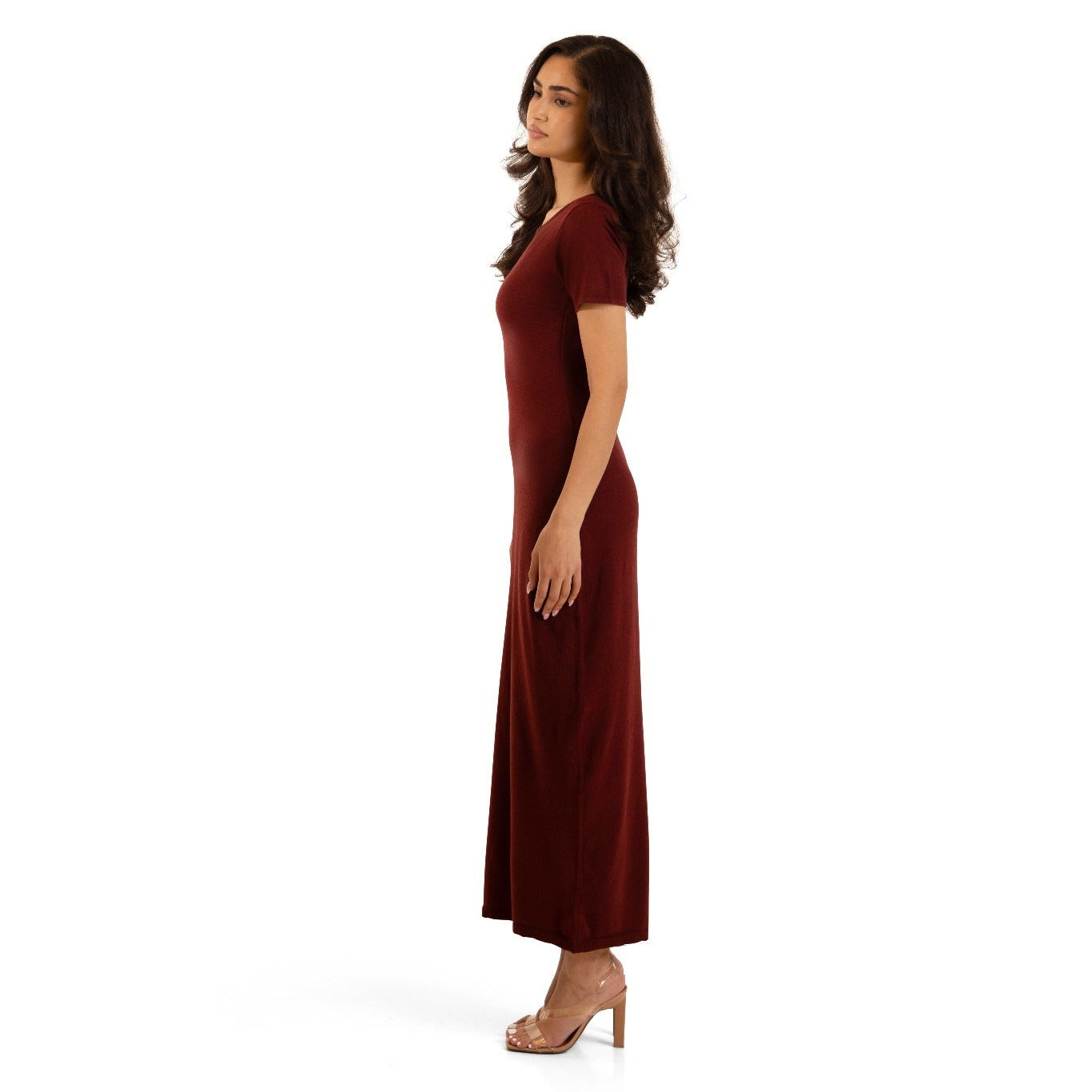 Cherry Burgundy Sienna knitted maxi underdress, relaxed side profile showing the long streamlined silhouette.